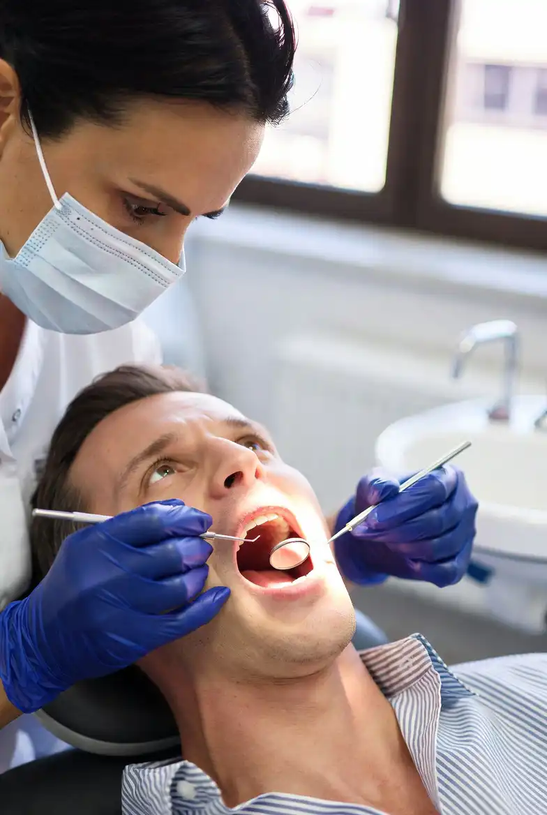 dentist inspecting patient